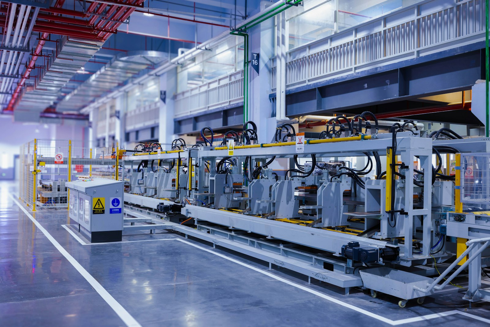 Industrial equipment lined up along a plant floor